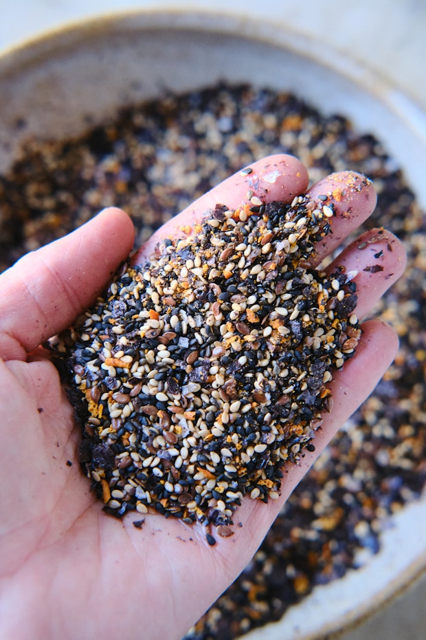 a handful of furikake ready to be sprinkled across a meal