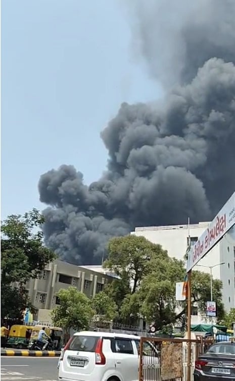 Thick plumes of smoke are seen after Air India flight AI171 crashed shortly after take off from Sardar Vallabhbhai Patel international airport.