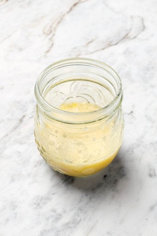 Champagne vinaigrette in jar.
