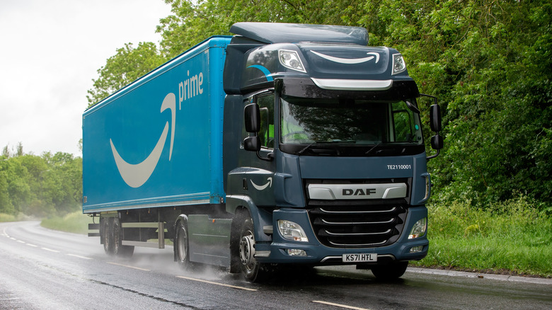 An Amazon truck driving down a road