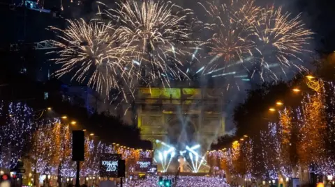 EPA Fireworks go off on the Arc de Triomphe in celebration of the new year on the Champs-Elysees avenue in Paris, France.