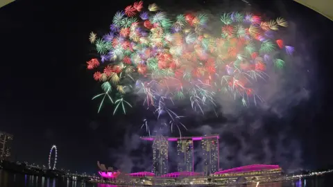 Getty Images Fireworks light up the sky at Marina Bay Waterfront in Singapore in celebration of midnight on New Year's Eve 2026.